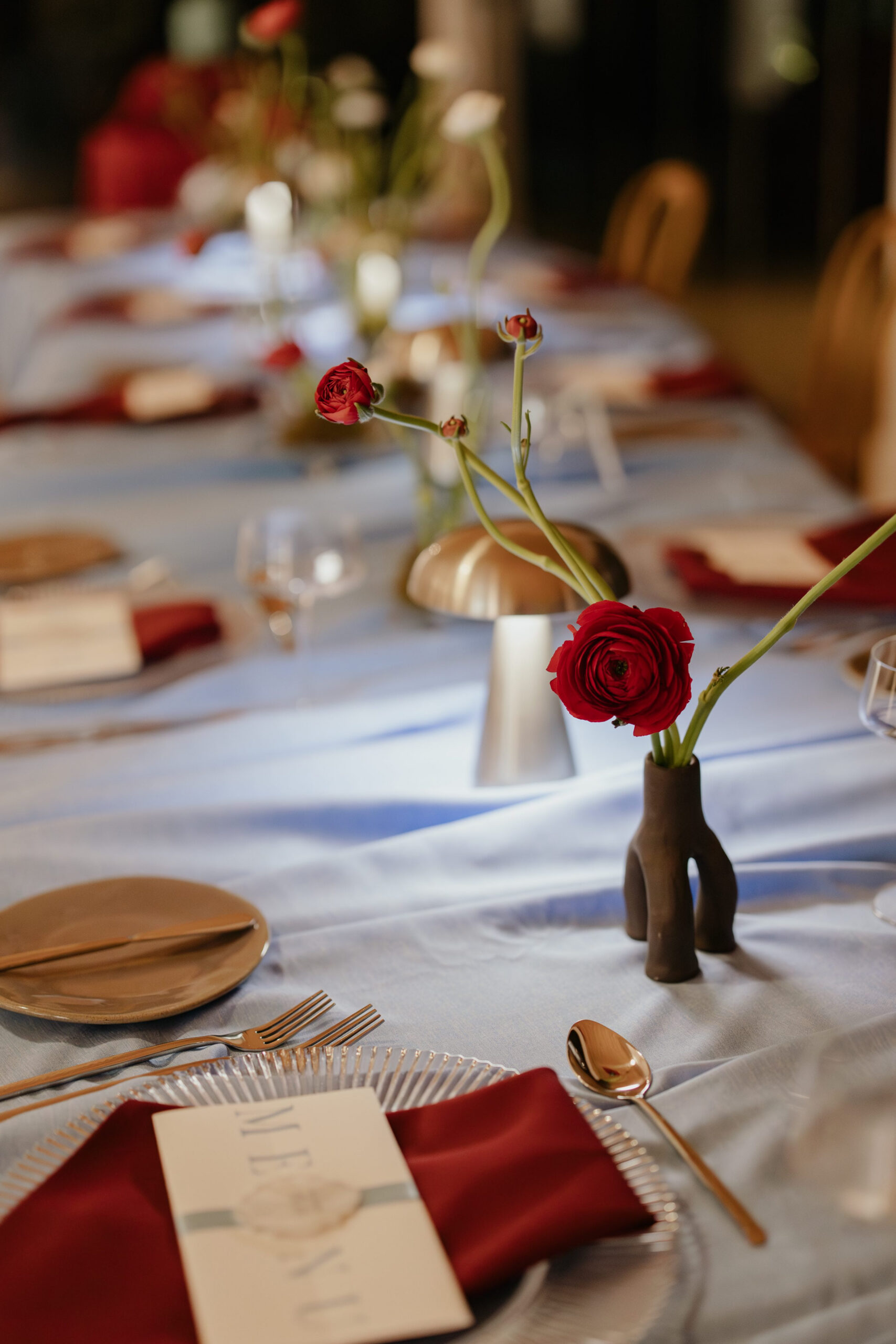 Acreate Styled Shoot Elegant event table styling with blue linens, burgundy napkins, silver tableware and delicate floral arrangements by a|CREATE