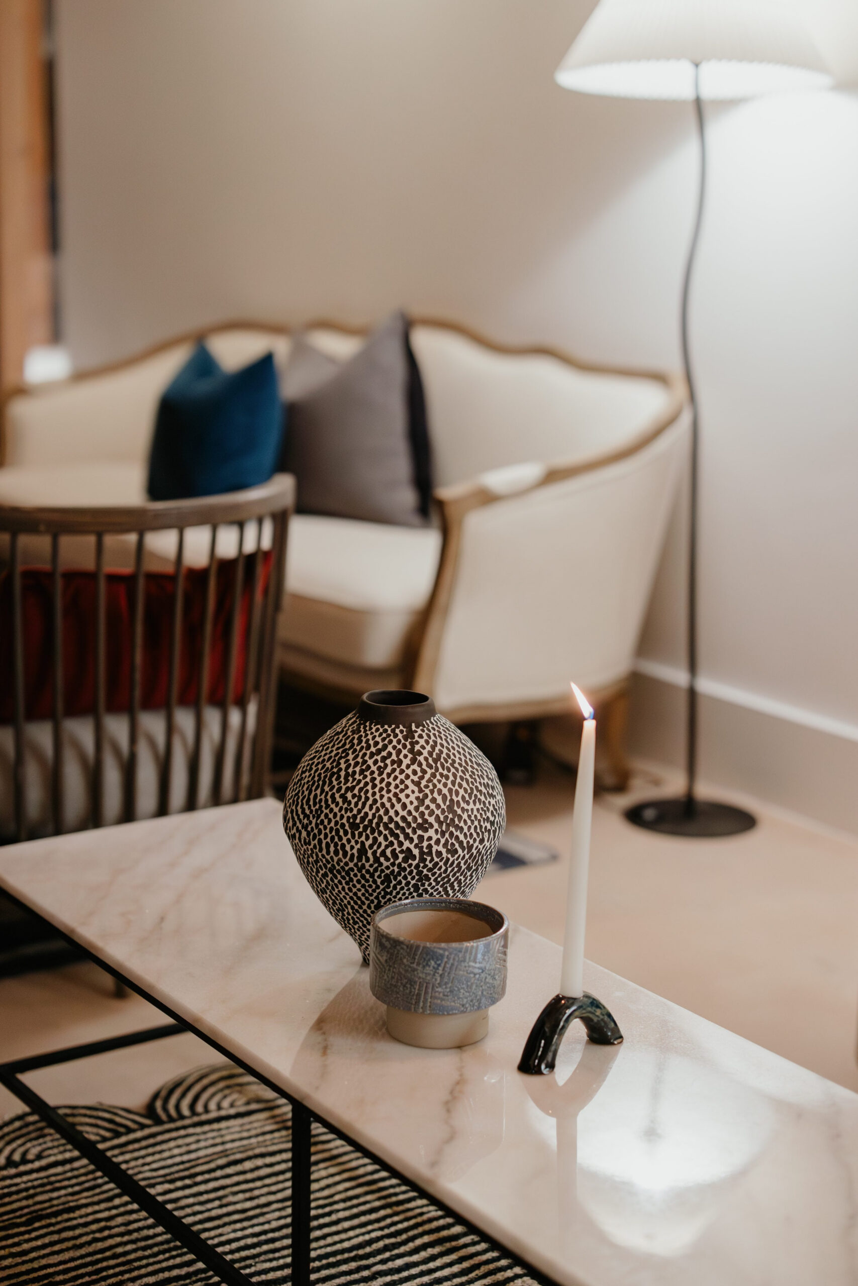 Acreate Styled Shoot Contemporary lounge styling with marble coffee table, statement décor, candlelight and elegant furniture by a|CREATE